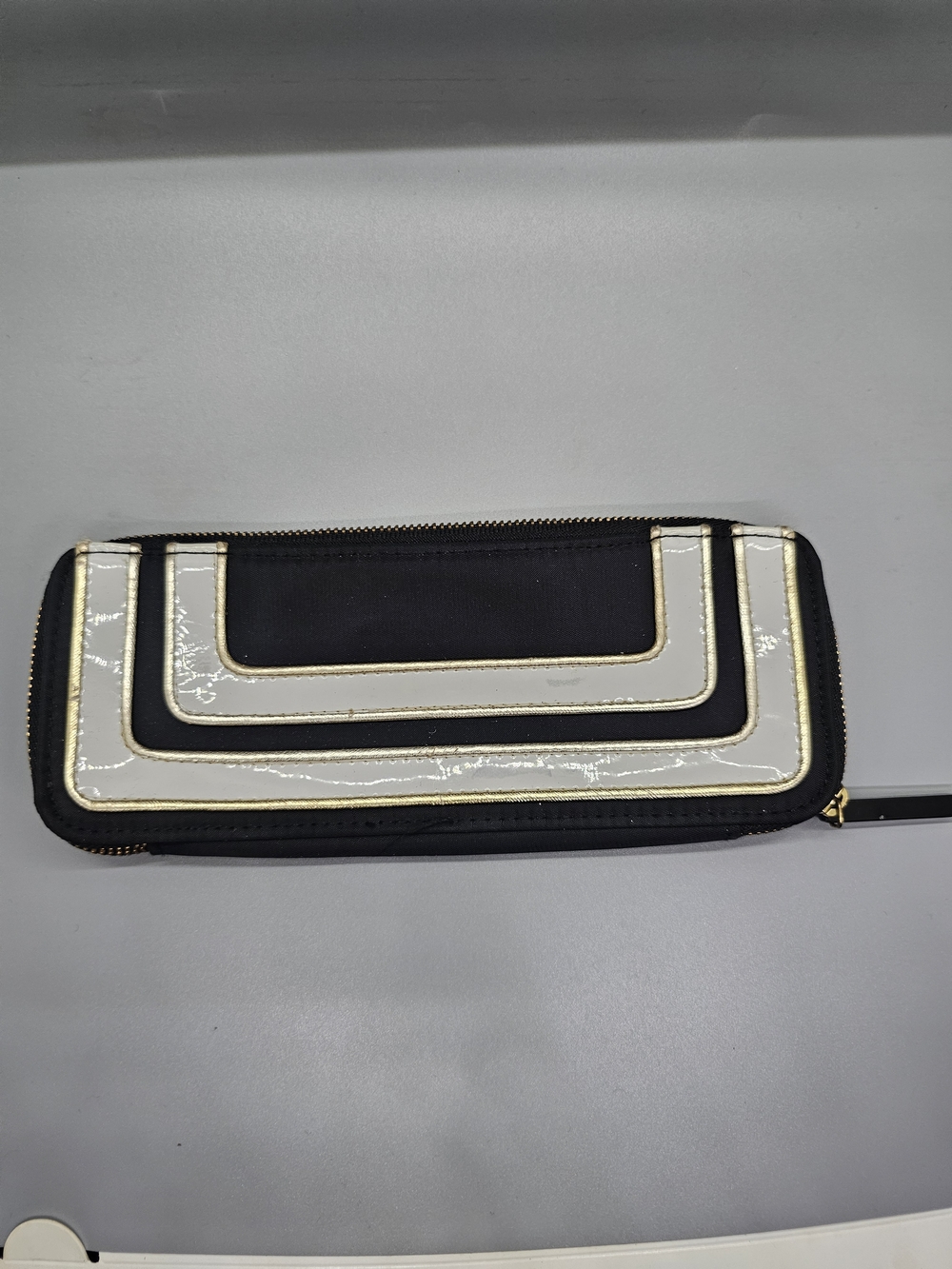 Black and White Zip-Around Wallet with Gold Trim